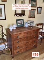 Full front view of chest showing four drawers, top surface and turned feet