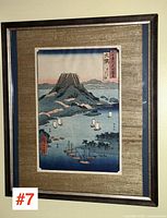 Overall view of framed Japanese print showing woodblock landscape, gold mat and dark frame