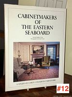 Front cover of the hardcover book "CABINETMAKERS OF THE EASTERN SEABOARD" showing title, subtitle, and a photo of a room with antique furniture.
