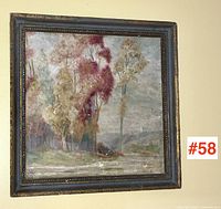 Frontal view of the framed painting showing the autumnal trees and landscape scene with the lot number visible on the wall.
