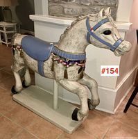 Front left perspective showing entire horse on base