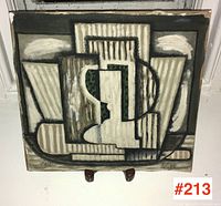 Full front view of geometric abstract painting on board displayed on stand, shows overall composition and colors