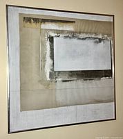 Front-facing view of abstract artwork in silver metal frame