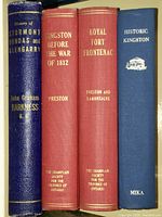 Four hardcover volumes side by side showing spines