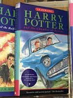 Close-up of Harry Potter and the Chamber of Secrets hardcover book with illustrated dust jacket.