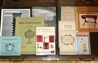 Lot of 9 small reference books on glass, pottery, furniture, porcelain, and other related subjects shown together