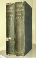 Two volumes of the "Arctic Explorations" series showing full spines, volumes I and II, highlighting the binding and wear condition.