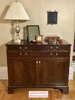 Full front view of desk with surface items