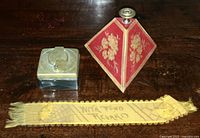 Image showing the inkwell, paperweight, and bookmark on a wooden surface.