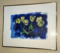 Front view of framed acrylic painting depicting yellow tulips on a blue background.