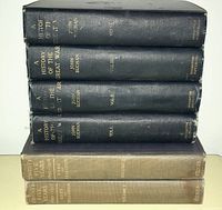 Side view of six black cloth bound volumes titled 'A History of The Great War' by John Buchan with gold embossed titles on the spine.