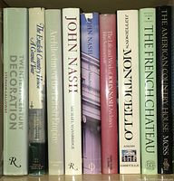 Nine vintage coffee table books on architecture and design on a shelf. Titles visible and condition of dust jackets shown.