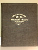Clothbound hardcover cover with gilt-stamped title 'Illustrated Historical Atlas – Frontenac, Lennox and Addington Counties, Ont. J.H. Meacham & Co. 1878.'