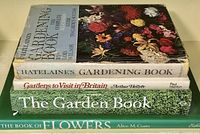 Stacked view of four gardening and flower books showing title and cover art