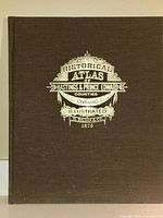 Front cover showing brown cloth binding with gold embossed title: Historical Atlas of Hastings & Prince Edward Counties Ontario Illustrated H. Belden & Co. 1878