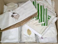 Drawer full of folded white and off-white linens