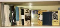 Shelf of Montreal history books in various bindings and conditions.
