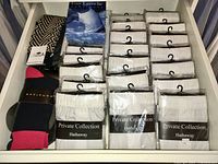 Drawer of new white boxer shorts in packaging, mostly Hathaway Private Collection, plus some Guy Laroche boxed shorts and socks.