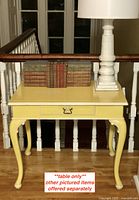 Full frontal view of side table showing top surface, drawer front, and legs