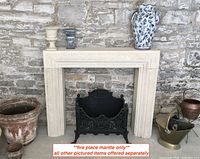 Front view of entire fireplace mantle against brick wall