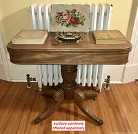 Full front view of the flip-top games table with surface contents