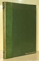 Front cover of the book showing green leather binding with gold lettering on spine and front corner.