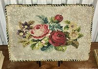 Full view of the Victorian glass beadwork panel featuring a floral bouquet against a light background on a fabric backing with twisted cord trim.