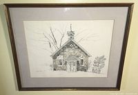 Framed vintage print showing the full artwork of the stone chapel drawing with light beige mat and gold-tone frame.