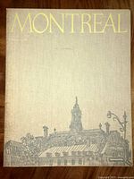 Folio cover with title 'Montreal' and cityscape illustration on textured fabric binding