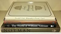 Four books stacked to show spines and partial covers, titles related to William Notman and early Canadian photography