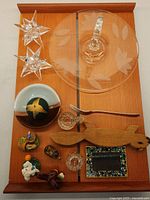 Top view showing all items arranged on the Knoll fir tray. Includes star candle holders, etched glass tray, decorative figurines and small dishes.