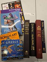 Seven books displayed with visible titles including art and literature topics.