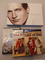 Collection of Paul Newman DVDs with box set cover featuring a close-up of Paul Newman