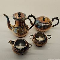 Full set of Portland silver plate tea service including teapot, coffee pot, creamer, and sugar bowl with some tarnishing and need for cleaning