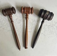 Top view of three wooden gavels showing shape, size, and finish details.