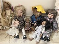 Full view of all 7 dolls showing variety and arrangement.