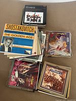 Stack of various classical vinyl record LPs including Shostakovich Symphony No. 6 'The Golden Age', Stamitz compositions, and other classical albums with illustrated covers
