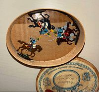 Hand-painted cavalry metal figures on horses inside an oval wooden box
