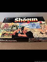 Front view of the Shogun game box showing title and artwork of samurai and historical Japanese imagery