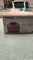 Box side of Voyager Kaito Voyager Weather Alert Multi-band Radio with crank shown and listed features.
