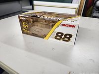 Side view of the diecast stock car box showing UPS branding, number 88, and Action logo.
