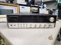 Full front view of the Harman Kardon 430 stereo receiver showing power button, control knobs and display.