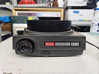 Front side view of Kodak Carousel 600 projector showing lens and labeling.