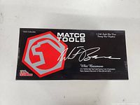 Top view of the closed black Matco Tools box featuring Whit Bazemore signature and replica details.