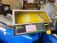 Front side view of National Biological Corporation Hand Foot II medical device showing the yellow-tinted cover and internal UV lamps.