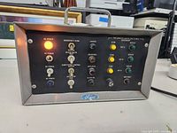 Front view showing control panel with switches, indicator lights, and Ford branding.