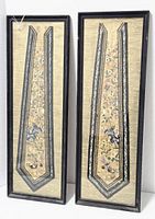 Pair of identical framed textile hangings standing side by side showing full length and condition of frames and fabric backing.