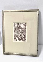 Front view of framed lithograph in silver-painted wood frame with off-white mat surrounding sepia print