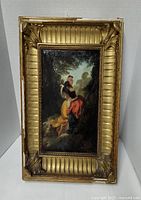 Front view of framed oil on board painting showing subject and frame