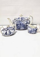 Full set showing teapot, sugar bowl, and creamer with Mikado pattern